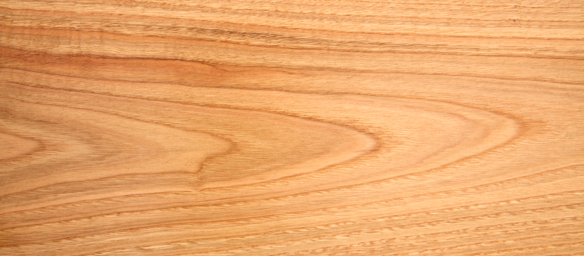 Oberfläche von Kastanienholz Nahaufnahme einer Kastanienholz-Maserung mit warmen Farbtönen und natürlicher, geschwungener Struktur.